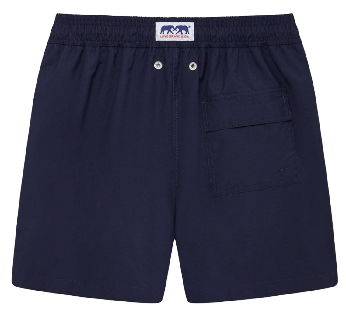 A pair of Love Brand & Co. Staniel Swim Trunk made from recycled polyester with an elastic waistband and a single pocket on the right side, perfect as quick-dry swimming trunks by Love Brand.