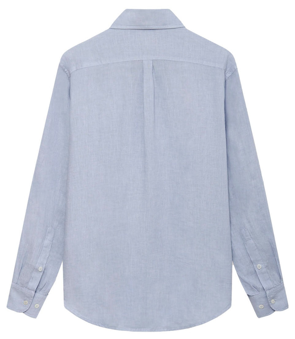 Rear view of a Love Brand & Co. Abaco Linen Shirt in light blue with a collar and cuffed sleeves, showcasing comfortable wear.