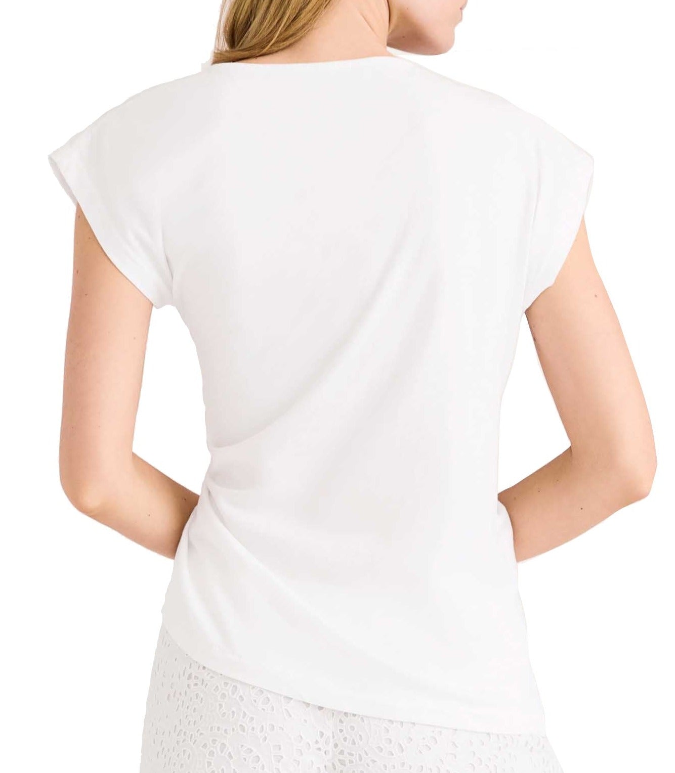 Woman wearing a Merlette New York organic cotton jersey, white Merlette Reverie Jersey Top viewed from the back.