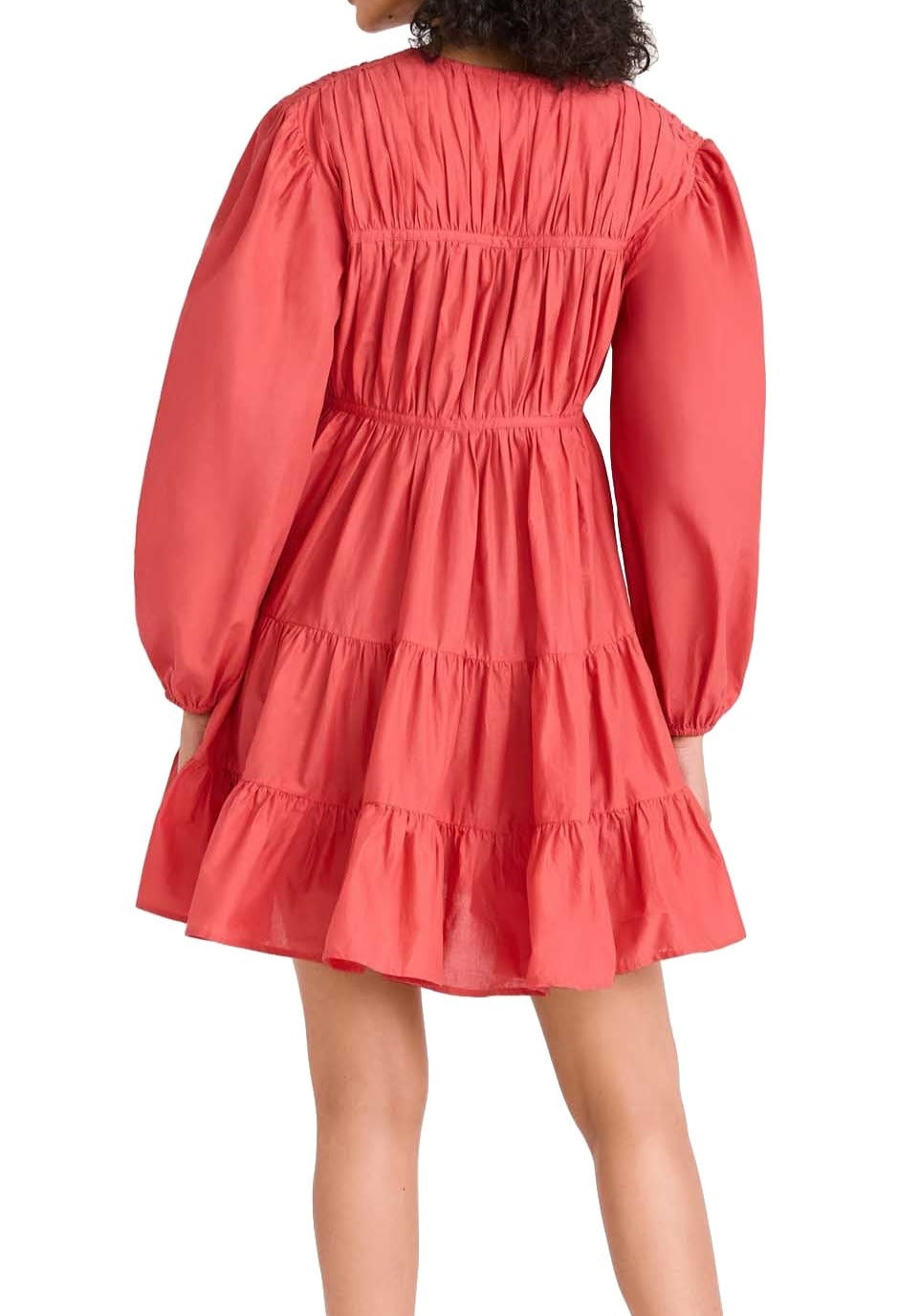 Back view of a woman wearing a red tiered lightweight cotton Merlette Lasse Dress with long sleeves and ruffled detailing from Merlette New York.