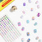 Introducing the Super Smalls Mermaid Press On Nail Kit, featuring ocean-inspired colorful mermaid press-on nails, a sheet of gem stickers, and a gold nail accessory—all displayed on a white background.