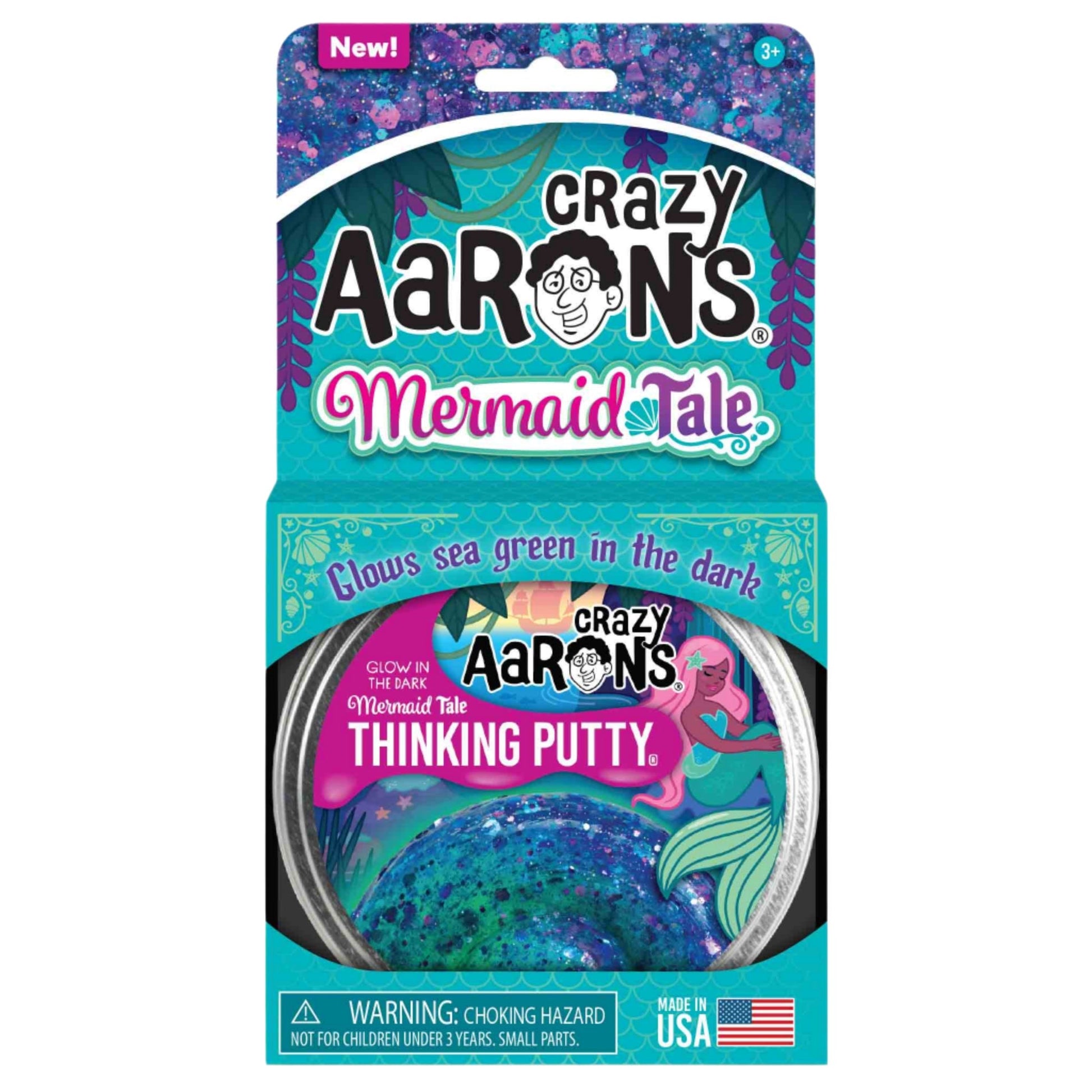 The packaging of Crazy Aaron's Thinking Putty, Mermaid Tale edition, showcases a glittery design. This non-toxic silicone putty glows sea green in the dark, making it ideal for sensory integration. It includes a warning label for choking hazards and is proudly made in the USA by Crazy Aarons.