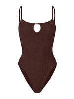 The Mia Beaded Swim by Hunza G is a brown one-piece featuring the brand’s signature crinkle fabric, slim shoulder straps, and a small keyhole cutout at the neckline.