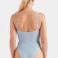 Woman with blonde hair in a ponytail wearing the Hunza G Mia Beaded Swim in light blue crinkle fabric, viewed from the back against a plain white background.