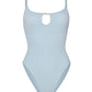The Mia Beaded Swim by Hunza G is a light blue crinkle fabric one-piece swimsuit, featuring thin shoulder straps, a subtle front keyhole detail, and a comfortable one-size fit.