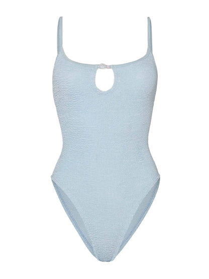 The Mia Beaded Swim by Hunza G is a light blue crinkle fabric one-piece swimsuit, featuring thin shoulder straps, a subtle front keyhole detail, and a comfortable one-size fit.