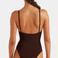 Woman with braided hair wearing a dark brown Hunza G Mia Beaded Swim one-piece, shown from the back against a plain background.
