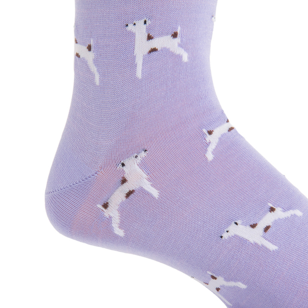 A close-up of the Dapper Classics Dog Mid Calf Socks in lavender, crafted from mercerized cotton, features a charming pattern of small white dogs with brown spots.