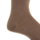 Close-up of a Dapper Classics Mushroom Solid Ribbed Fine Merino Wool Sock on a foot, highlighting the texture and stitching near the heel and ankle. Expertly crafted men's mid-calf dress sock with linked toe, made in North Carolina.