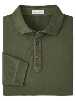 The Peter Millar Lava Wash Long-Sleeve Polo, in olive green, features a vintage aesthetic with three brown buttons and a visible brand label on the inside. It's crafted from soft Pima cotton and designed with a collared shirt style.