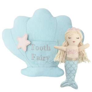 The MON AMI Mimi Mermaid Tooth Fairy Pillow Doll Set by Mon Ami features a charming mermaid doll, styled with braided hair and a pink top, accompanied by a soft blue tooth fairy pillow shaped like a shell with a star.