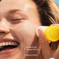 A person smiles while applying Supergoop Mineral Sheer Stick SPF 30 to their cheek; text notes its sheer, natural finish formula suitable for all skin types, even sensitive.