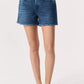 A person wearing Rag & Bone Miramar Terry Walking Shorts with a pull-on elastic waistband, paired with a black sleeveless top and black sandals, stands against a plain light background.