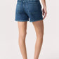 Person wearing Rag & Bone's Miramar Terry Walking Short with a pull-on elastic waistband, styled with a black top and sandals, stands with their back to the camera against a plain light background.