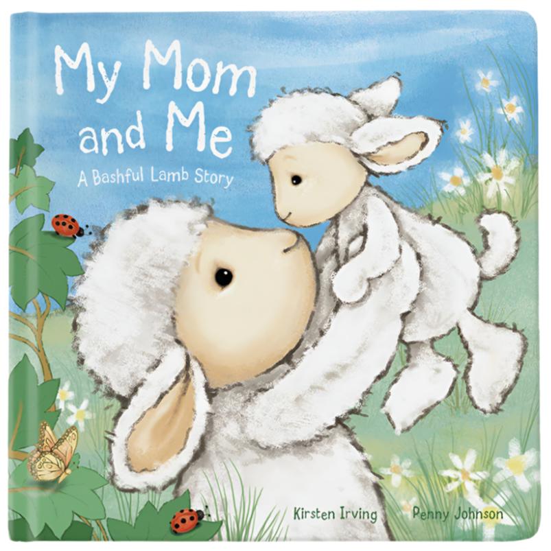 Cover of a children's book titled "Jellycat My Mom & Me Book," a perfect bonding book for Mother's Day by Jellycat, featuring an illustration of a mother sheep lifting her lamb in a green field with flowers and ladybugs.