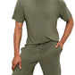 A man is wearing the Eberjey Henry Short PJ Set by Eberjey in olive-green TENCEL™ Modal. One hand rests in the pocket of his shorts against a plain white background.