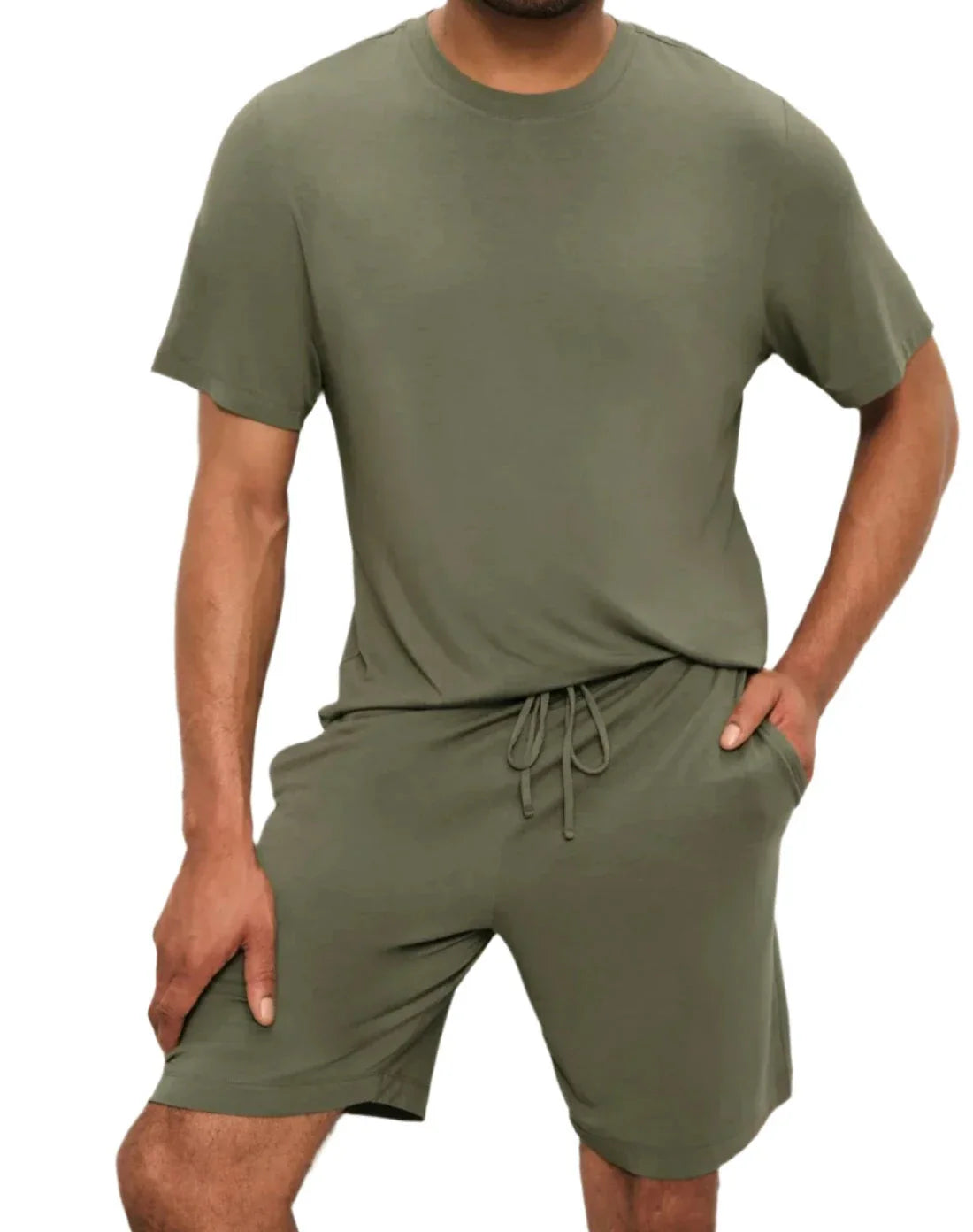 A man is wearing the Eberjey Henry Short PJ Set by Eberjey in olive-green TENCEL™ Modal. One hand rests in the pocket of his shorts against a plain white background.