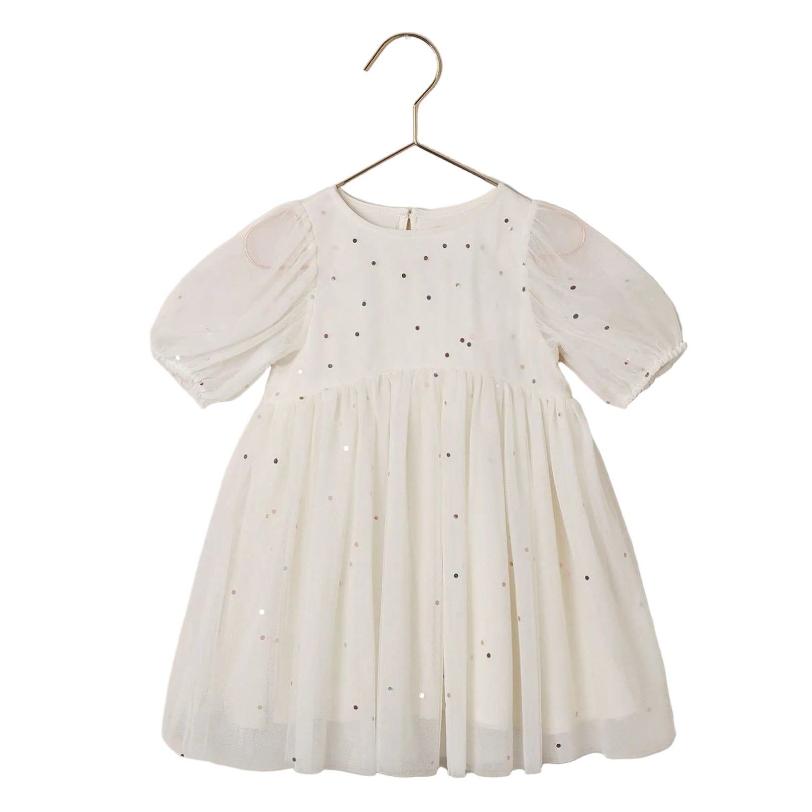 The Noralee Girls’ Luna Dress is a white babydoll mini dress for children, featuring short puff sleeves and multicolored sequins, shown on a gold hanger against a white background.