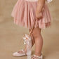 A young child wears the Noralee Tallulah Tutu in pink, paired with matching shoes, and holds a ribbon wand against a neutral background.