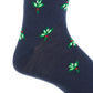 The Dapper Classics Dress Navy with Green and White Mistletoe Fine Merino Wool Sock features a mistletoe motif and a linked toe, offering breathable comfort in a stylish mid-calf design.