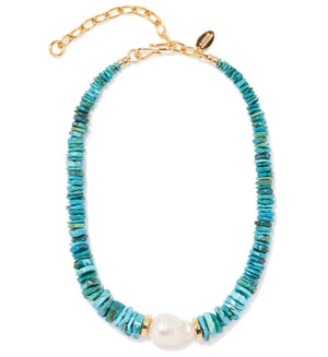 The Sky Stone Necklace by Lizzie Fortunato features a baroque freshwater pearl centerpiece, turquoise beads, gold accents, and an adjustable gold chain clasp.