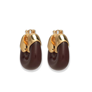 Lizzie Fortunato's Organic Gold Hoops feature gold-toned metal tops and curved dark brown resin bottoms for a bold, modern look.
