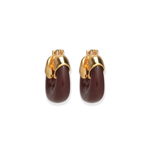 The Lizzie Fortunato Organic Mini Gold Hoops feature gold-plated brass on the top half and dark brown resin on the bottom, shown against a white background.