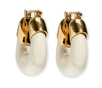 Lizzie Fortunato Organic Mini Gold Hoops feature thick, curved white resin hoops and gold-toned metal tops, creating stylish, gold-plated mini hoop earrings.