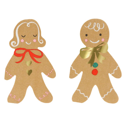 Meri Meri Gingerbread Napkins feature two charming gingerbread figures adorned with decorative icing and bows—one with a red bow and two green heart details, the other with a gold bow and multicolored buttons—making them delightful festive decorations for your Christmas party table.