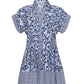 The Nash Mini Dress by Cara Cara features a collared neckline, buttoned front, side seam pockets, and a blue and white mixed floral and geometric pattern.