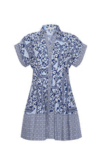 The Nash Mini Dress by Cara Cara features a collared neckline, buttoned front, side seam pockets, and a blue and white mixed floral and geometric pattern.
