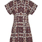 The Cara Cara Nash Mini Dress is a short-sleeve collared mini shirtdress with a brown, maroon, and blue paisley print on cream, featuring a pleated skirt and button front for an ideal fit.