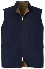 The Peter Millar Brentwood Reversible Fleece Vest is a sleeveless navy outerwear piece made with windproof fabric. It includes two front pockets, a front zipper closure, and a stand-up collar. The vest is stylishly enhanced with an interior lining in a contrasting brown color for added comfort and fashion appeal.