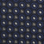 Close-up of the Robert Jensen Circle Dot Pattern Tie featuring blue and white circular designs on a dark background, showcasing an artistic expression reminiscent of traditional artisans.