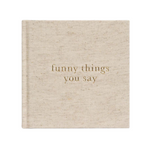 A Write To Me Funny Things You Say Oatmeal journal by Write To Me is titled "funny things you say" in gold letters on the cover, perfect for jotting down memorable quotes from your kids.