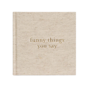 A Write To Me Funny Things You Say Oatmeal journal by Write To Me is titled "funny things you say" in gold letters on the cover, perfect for jotting down memorable quotes from your kids.