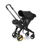 The Doona Car Seat and Stroller by Doona is a versatile black and yellow baby stroller that also functions as a car seat, complete with a hood and an adjustable handle for added convenience.