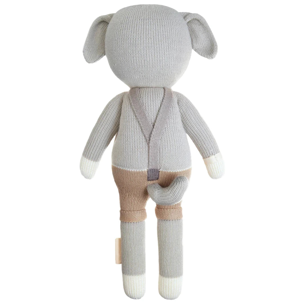 Cuddle + Kind’s Noah the Dog – Regular 20” is a plush toy resembling a gray dog in brown and beige overalls, shown from the back—perfect for any NoahBirthday celebration.