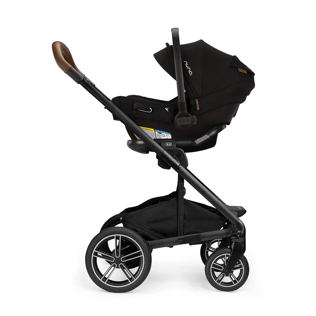 A black Nuna stroller with the Pipa Aire RX Carseat attached, featuring smart security features, a spacious lower storage basket, and four large wheels.