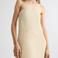 Someone models the Carolyns Sequin Netting Gown by TWP, a strapless beige maxi dress, against a plain background.
