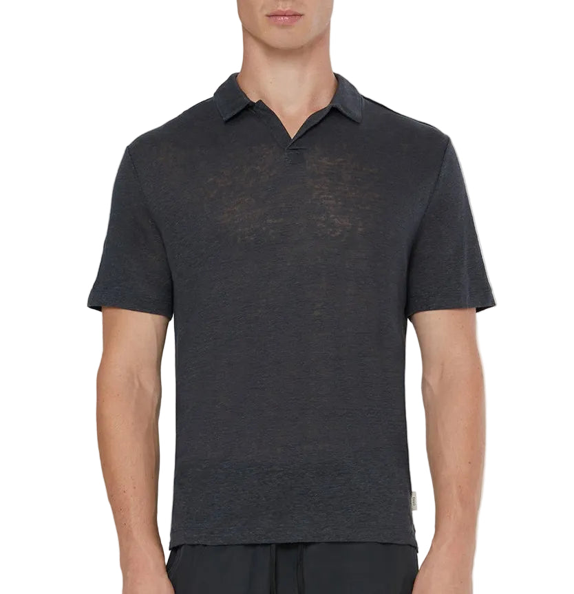 A man stands facing forward against a plain background, wearing the Onia Shaun Linen Polo—a short-sleeve, dark gray, relaxed fit top with a Johnny collar.