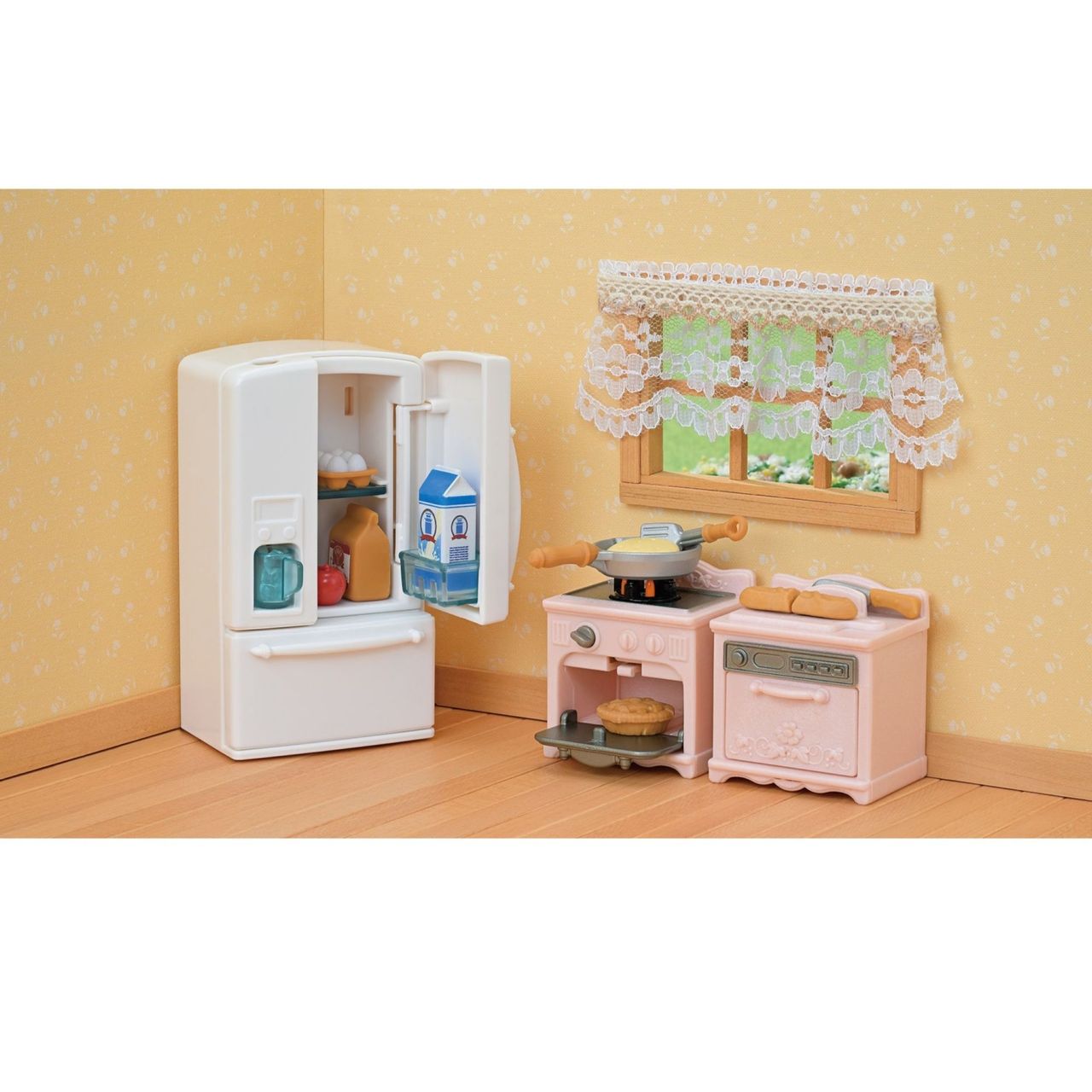 Create a revised sentence based on the product data: Transform your playtime with the Calico Critters Playful Starter Furniture Set, featuring a charming miniature kitchen scene complete with a white fridge, pink stove filled with food, and a window with lace curtain set against a cheerful yellow patterned wall—ideal for interactive toys and endless imaginative play.