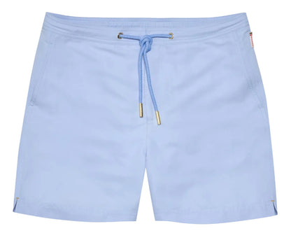 The Orlebar Brown Bulldog Drawcord Swim Short features a light blue, quick-drying fabric, gold-tipped rope-style drawcord, drawstring waist, side pockets, and small side slits at the hem.
