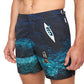 A man wearing Orlebar Brown Bulldog Photographic Swim Trunks featuring an aerial print of a swimmer diving underwater and a white kayak on blue water.