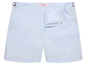 Orlebar Brown Bulldog Swim Short in Surfside Blue is shown laid flat, featuring adjustable side tabs, an open waistband with button and zipper closure, and quick-drying fabric for stylish comfort.