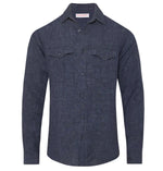 The Colburn Lino Shirt by Orlebar Brown is a tailored, long-sleeve button-up denim shirt with two chest pockets and a collar, shown against a white background.