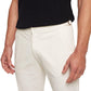 A person wears a black short-sleeve shirt and Orlebar Brown Fallon Stretch-Cotton Pant in off-white, shown from mid-torso to thighs, with arms relaxed at their sides.