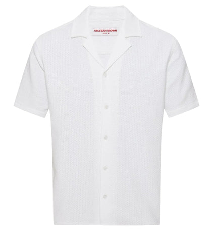 The Orlebar Brown Maitan Open Weave Shirt is a white, short-sleeve shirt with textured fabric and a Capri collar, shown against a plain background.