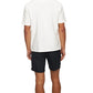 A person faces away, wearing the Orlebar Brown Maitan Open Weave Shirt with black shorts against a plain white background.