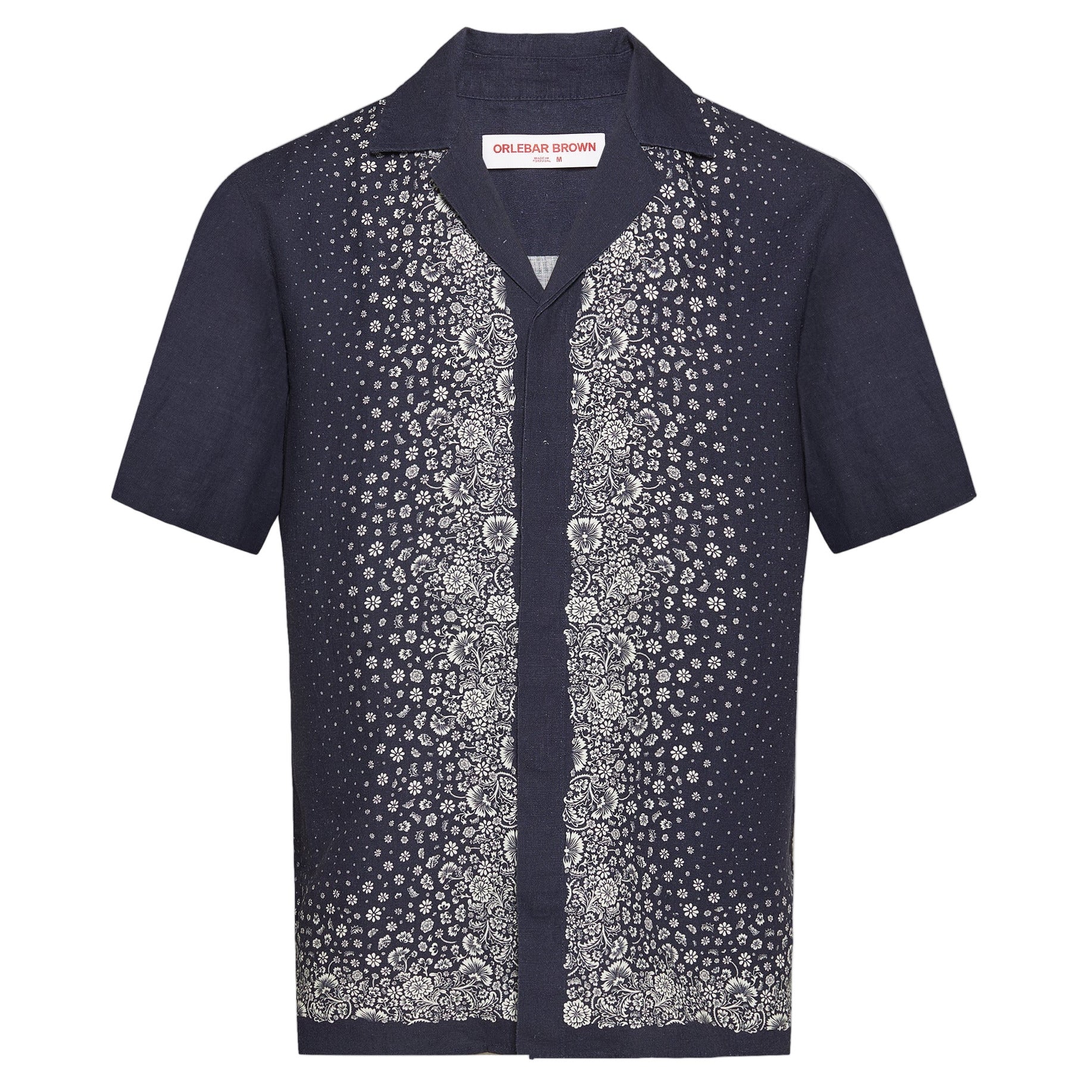 The Orlebar Brown Maitan Plant Shirt is a short-sleeved, dark navy summer shirt featuring a stylish Capri collar and a white plant pattern down the front.